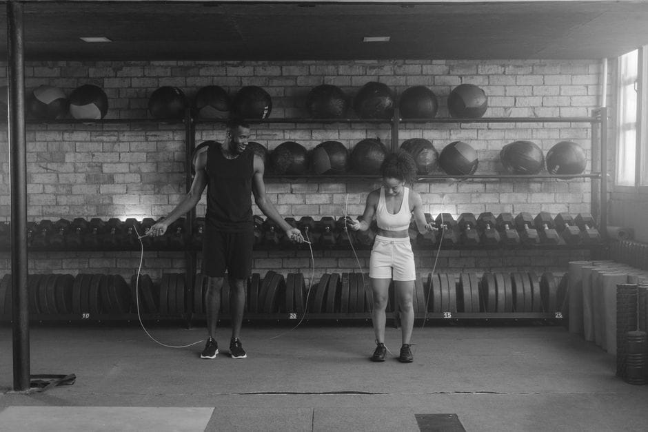 Athletic person jumping rope in living room
