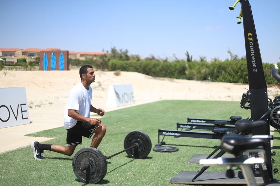 beginner doing burpee exercise during HIIT workout