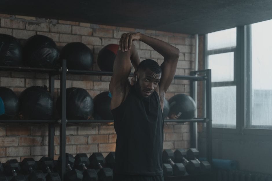 woman stretching hamstrings after HIIT session
