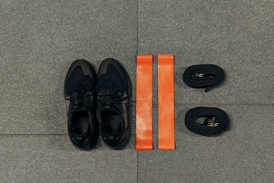 Colorful resistance bands arranged on a workout mat for home training