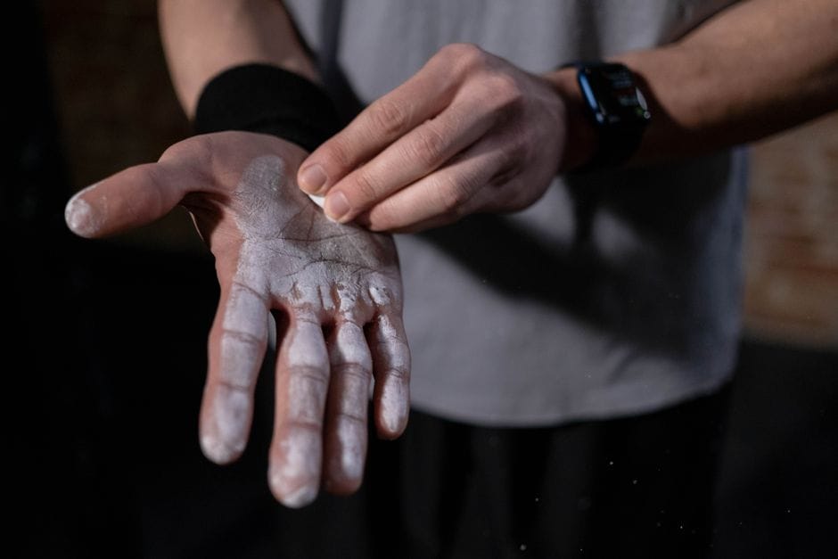 pre-workout supplement being mixed with water in a shaker bottle