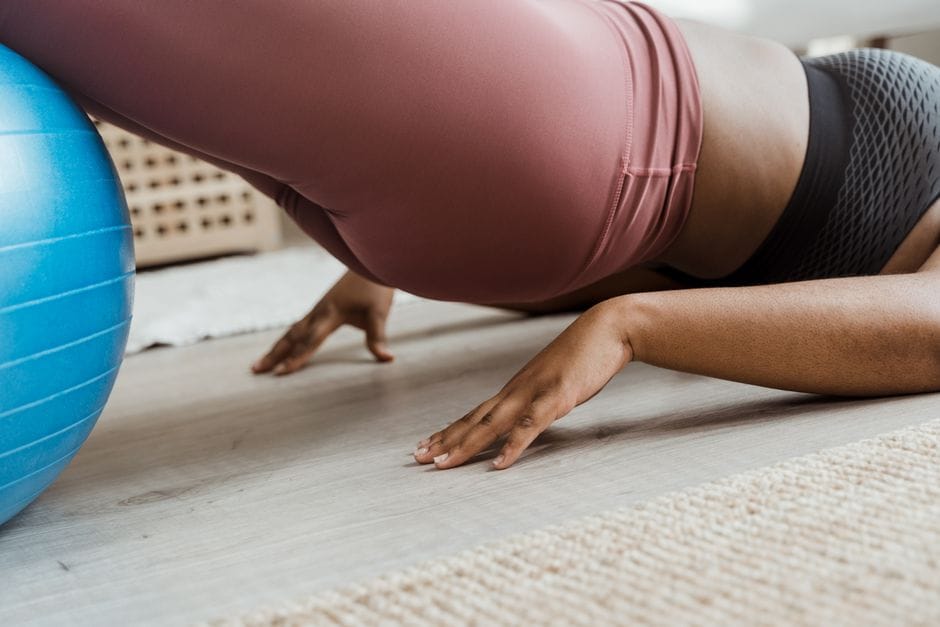 Close-up of proper hip thrust top position with glutes squeezed