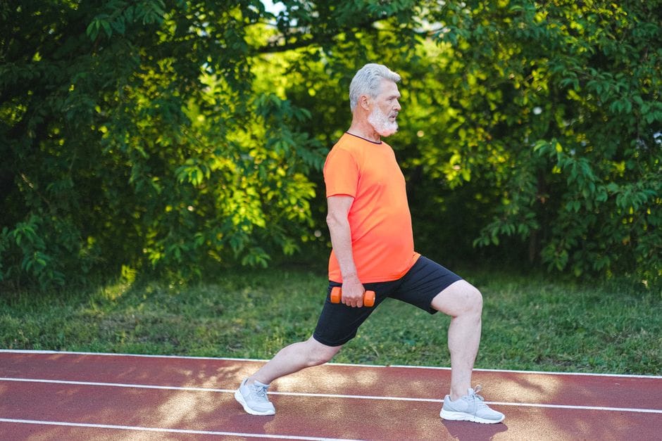 Woman demonstrating proper forward lunge form with front knee bent