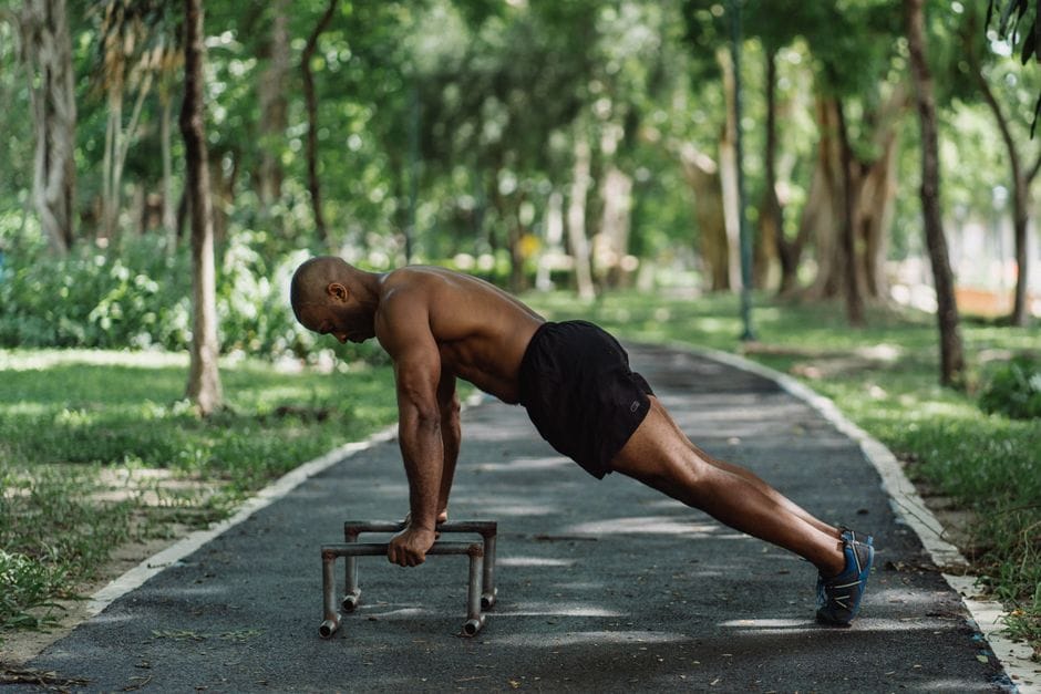Person in plank position during a burpee at home