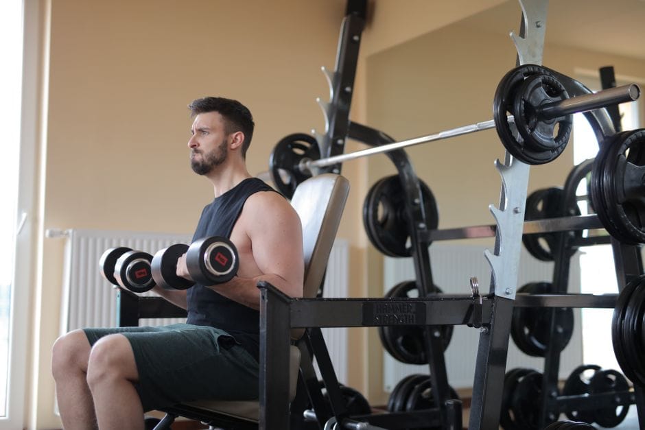 Person performing a hammer curl with dumbbells at their sides