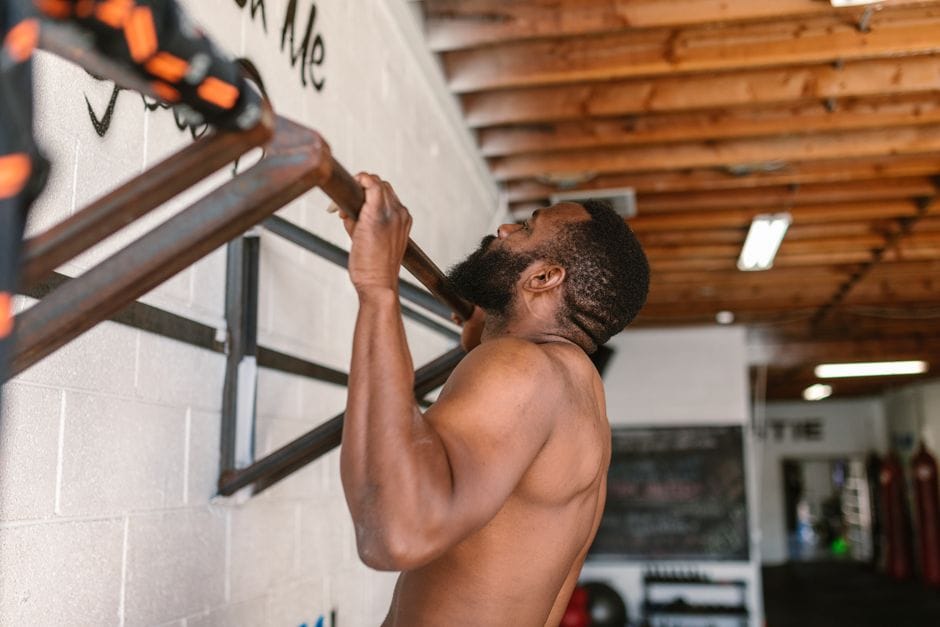 Person performing a lat pulldown with the bar at chest height, elbows down